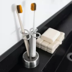 MONTESSA brushed stainless steel toothbrush holder with 4-slot clover design