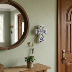 Hand-painted porcelain cross hang on the wall