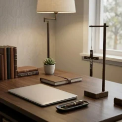Standing Wood Crucifix with Pedestal on the desk.