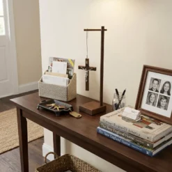 Standing Wood Crucifix with Pedestal on the entryway table.