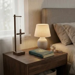 Standing Wood Crucifix with Pedestal on the nightstand.