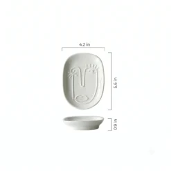 Dimensions and size guide for the Motessa abstract face ceramic tray, measuring 4.2 inches wide, 5.6 inches long, and 0.9 inches thick.